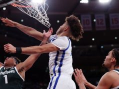 การที่รัฐมิชิแกนรื้อถอนรัฐเคนตักกี้เน้นย้ำถึงความแตกต่างทางปรัชญาในบาสเก็ตบอลระดับวิทยาลัย